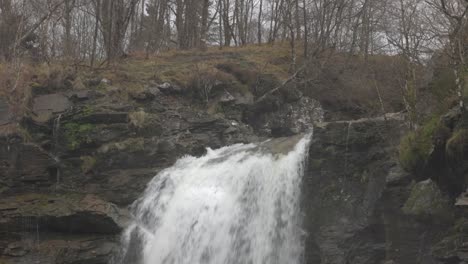 Slow-tilting-shot-revealing-the-cascading-drop-at-the-Falls-of-Falloch