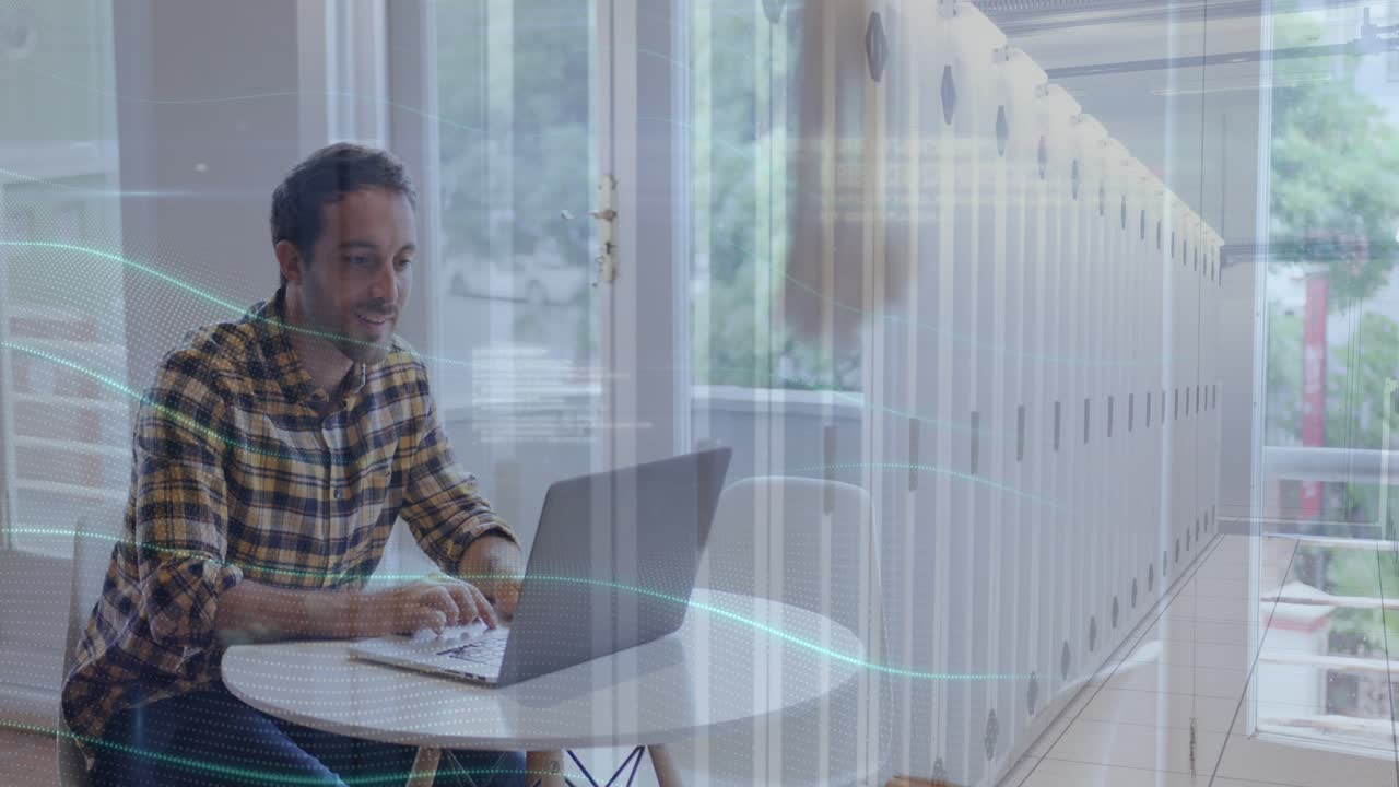 Animation of server room and programming language over caucasian man working over laptop