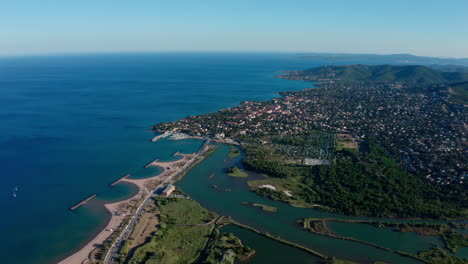 River-l'Argens-joining-the-mediterranean-sea-Saint-Aygulf-city-in-background