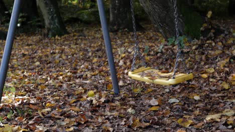 Grungy old swing set moves on it's own, no people in clip