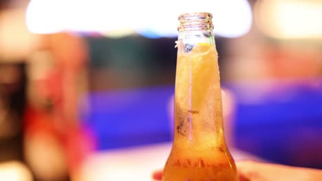 beer bubbles rising in a glass bottle