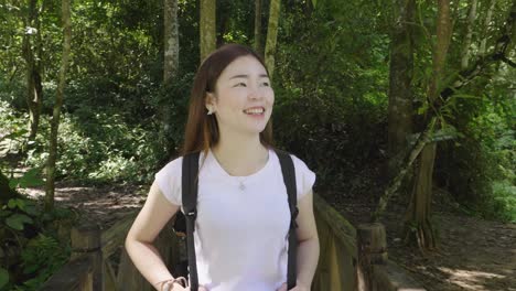 woman hiking in a tropical forest