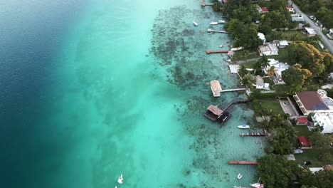 aerial beach town of bacalar mexico resort in seven colours lagoon with sailboat