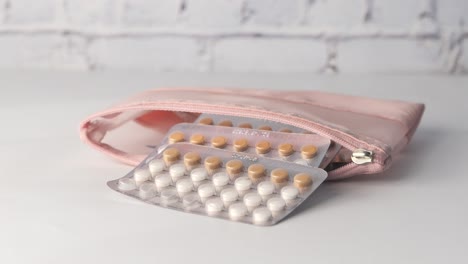 pink pouch with birth control pills