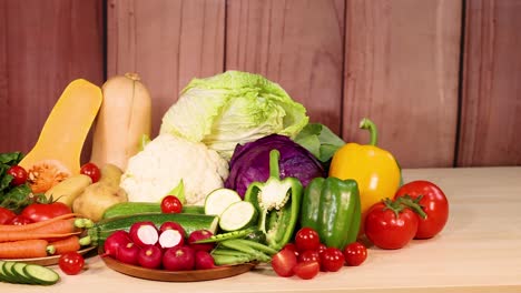 assorted vegetables arranged on a wooden table