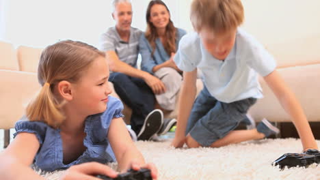 Smiling-siblings-playing-video-games