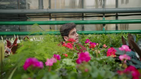 botanical expert assists young man in choosing perfect plants