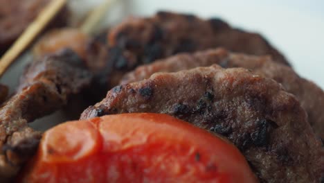 grilled meat skewers with tomatoes