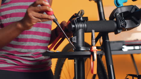 close up of specialist preparing work tools, patching up faulty bicycle parts