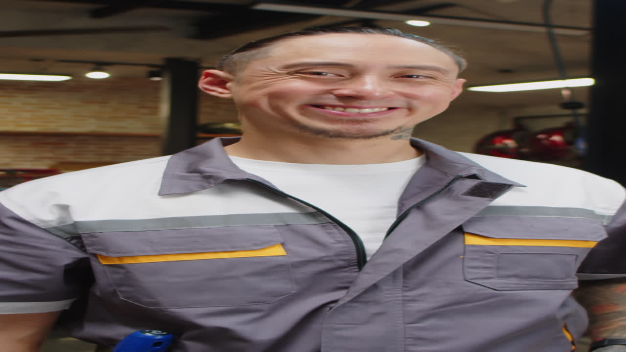 Portrait of Cheerful Mechanic in Garage