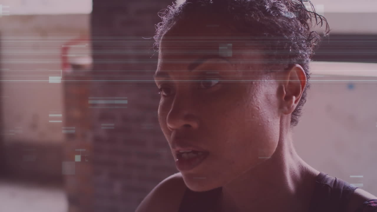 Animation of interference over african american sportswoman at gym