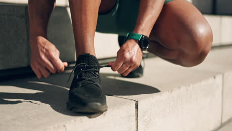 hands, shoes and tie with a sports person