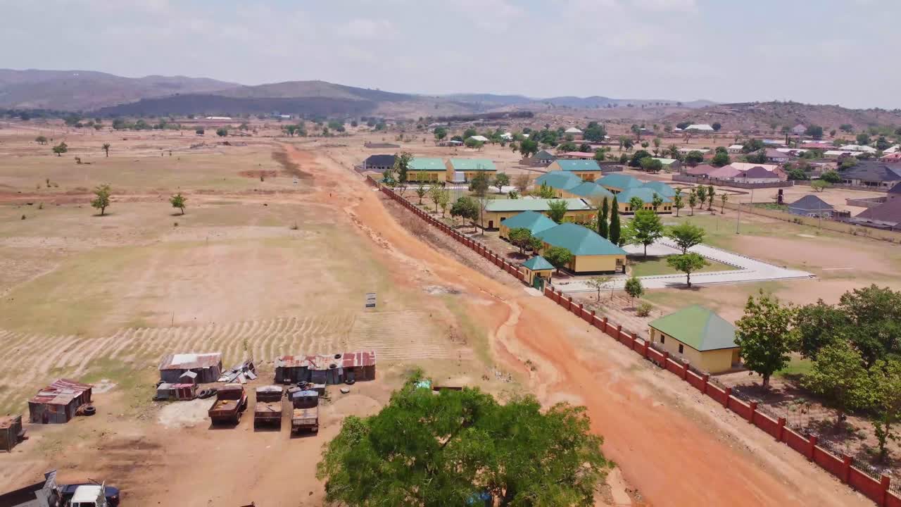 Aerial of a small town with compounds and gated communities in the beautiful Nigerian countryside