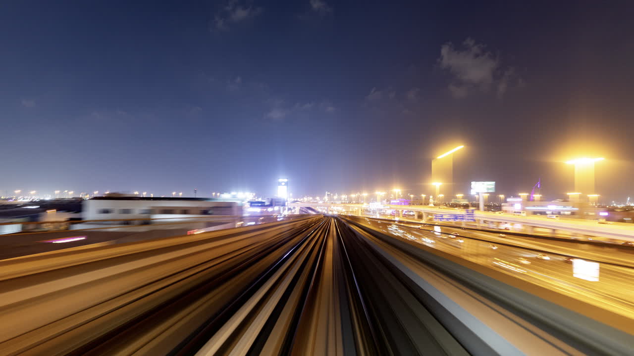 POV Time Lapse of Metro Train Moving Through City at Night