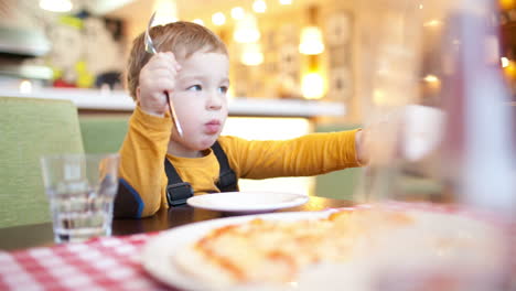 little boy in cafe