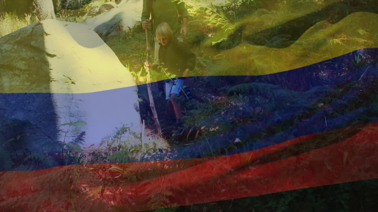 Hiking through lush forest, people carrying Colombian flag with animation overlay
