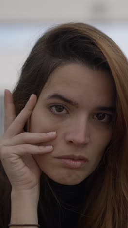 a series of close-up portraits of a woman expressing various emotions