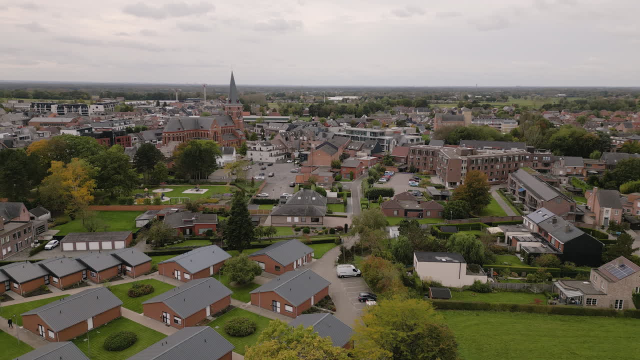 Church tower and cute township of Putte in Belgium, aeiral view