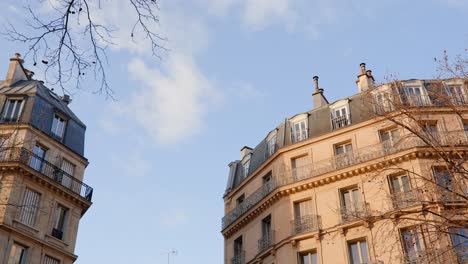 parisian corner residential buildings with blue sky in the background