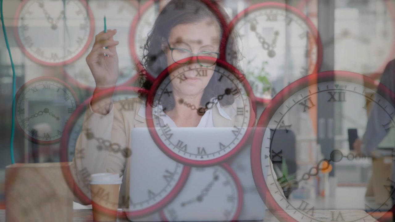 Office worker typing and tapping pen at laptop while clock overlay showing deadline, driving edits