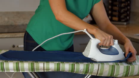 woman ironing her clothing