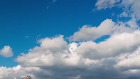 time lapse of clouds over a hill