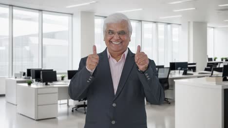 Happy-Indian-senior-manager-showing-thumbs-up