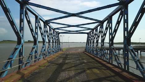 abandoned rusted iron bridge on derelict dockland at fleetwood docks lancashire uk