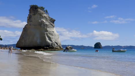 low down wide shot of waves at te hoho rock and cathedral cove beach