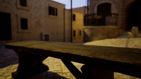 rustic wooden bench in quiet cobblestone alley at twilight