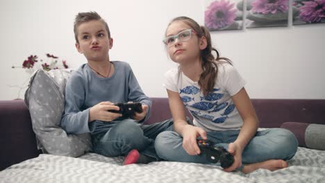 friends playing video game fight at home. boy and girl playing video games