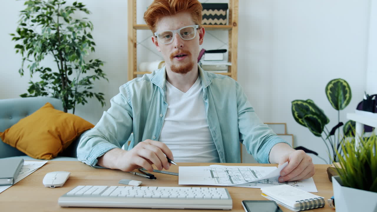 Man Presenting House Floor Plan Online