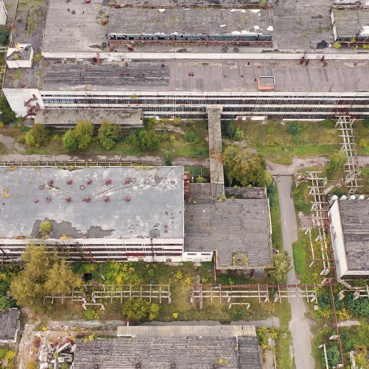 Industrial big destroted factory. Aerial view of factory constructions