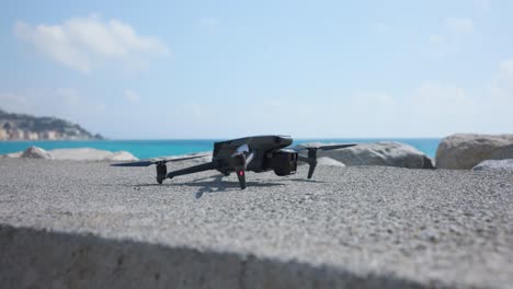 Landing-DJI-Mavic-3-Pro-drone-on-concrete-ground