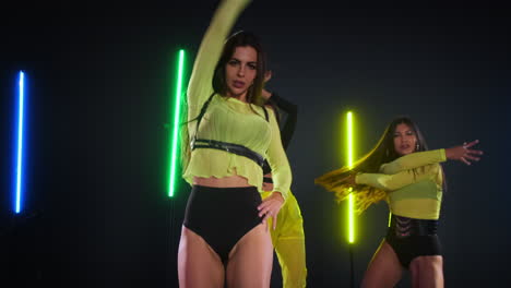 women dancing with neon lights