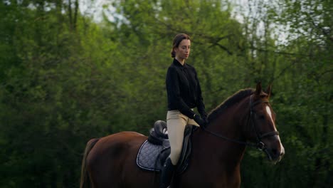 woman horseback riding in a peaceful park setting