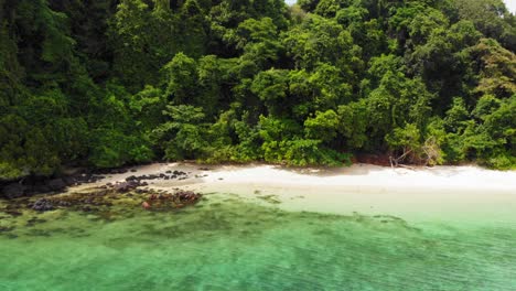 aerial tracking shot of beautiful exotic beach on paradise island on andaman sea in thailand - koh kradan