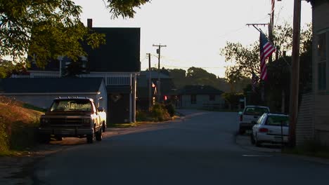 a shady street at a lobster village in stonington maine