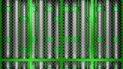 green metal pipes behind a metal grid