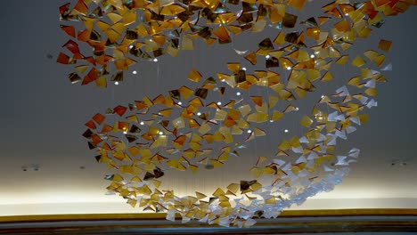 a ceiling decorated by colorful glass and white led strip in a large hotel in el alamein, egypt low angle shot