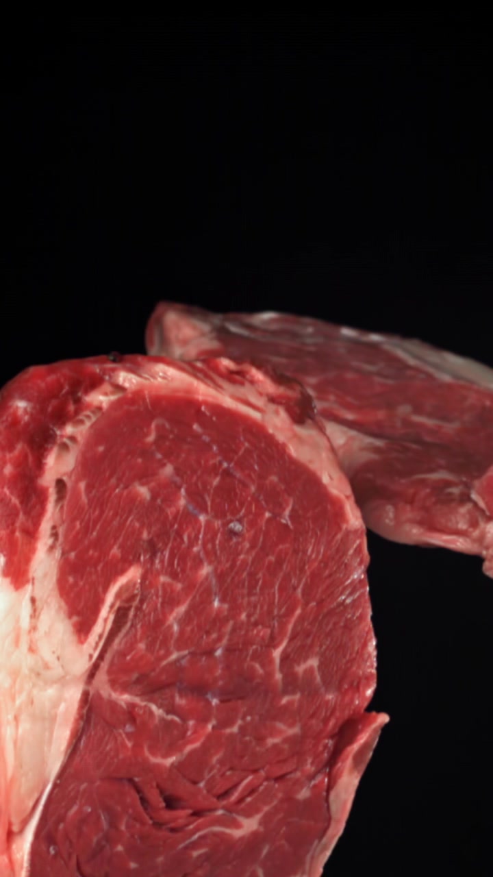 Close-up of Fresh Raw Beef Steak on Black Background