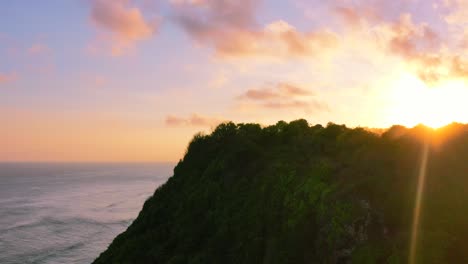 aerial coastline of uluwatu cliff peaks revealing magical golden sunset in bali indonesia