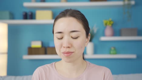 close-up of worried asian young woman.