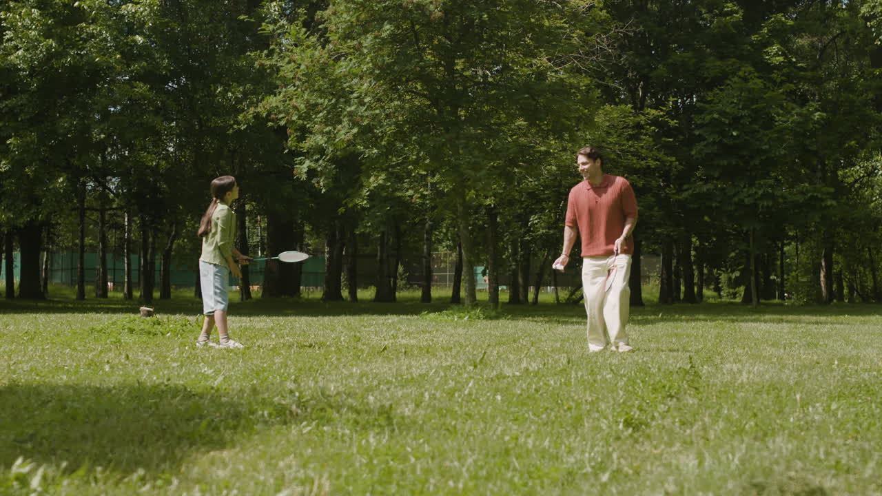 People playing badminton in the park