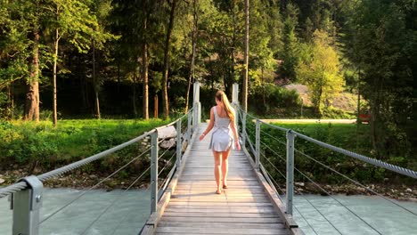 This-is-another-4k-clip-of-the-girl-walking-across-the-bridge