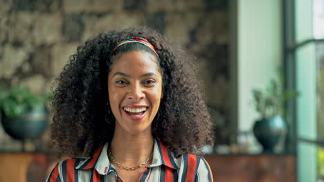 portrait of a smiling woman with curly hair