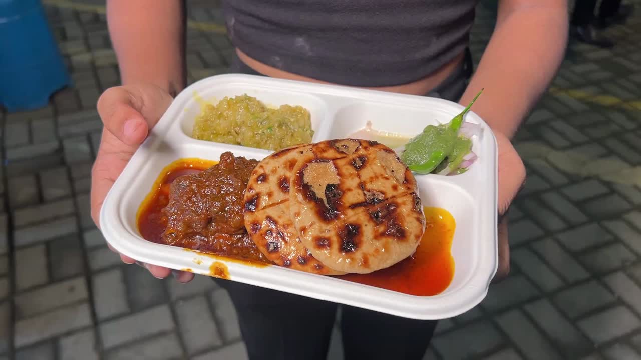 Litti chicken with chutney and chokha served in a street cart in India
