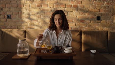 woman enjoying a cup of tea at home