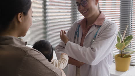 doctor examining newborn baby