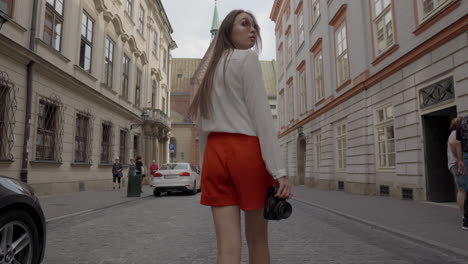 woman walking through a european city